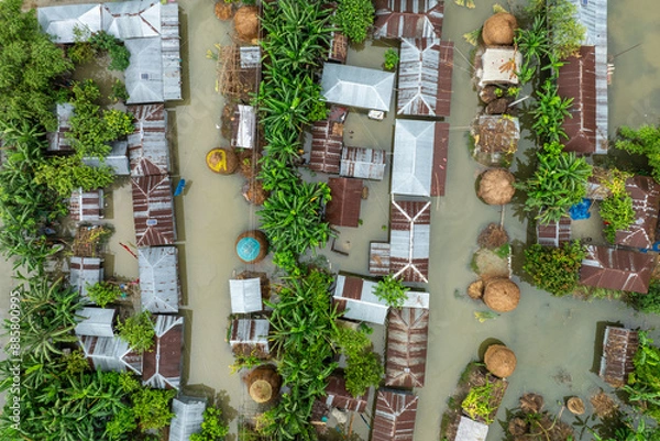 Obraz Aerial view showcasing the devastating impact of floods on villages in Northern Bangladesh, highlighting the submerged homes, affected communities, highlighting the severe impact and the resilience