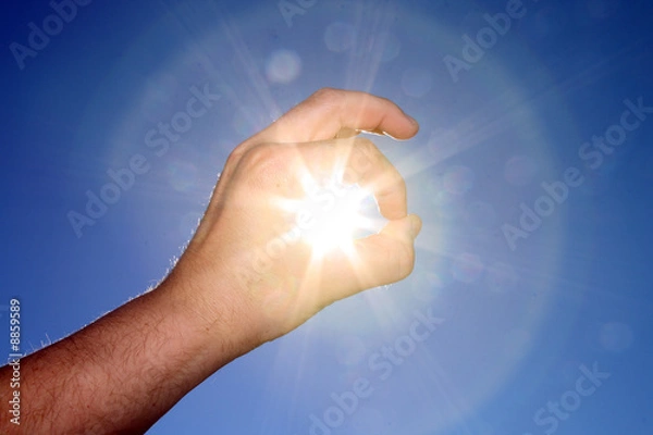 Obraz Hand catching the sun on blue sky