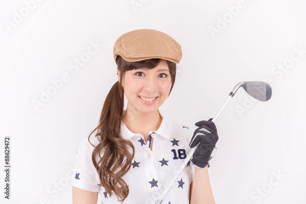 Obraz ゴルフを楽しむ若い日本人女性
