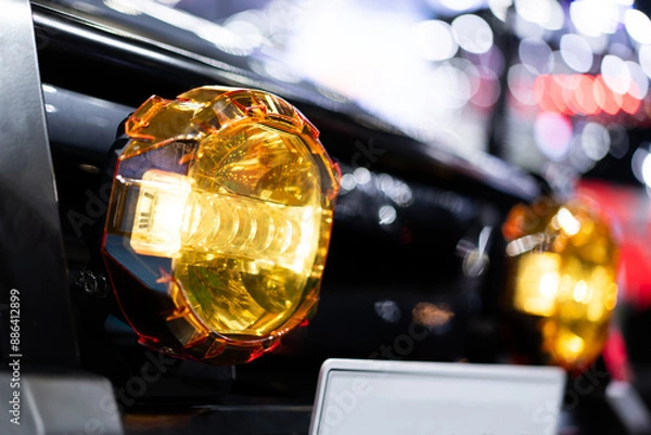Fototapeta LED fog lights, fog spotlights installed on the bumper of off-road vehicles. On the background bokeh light