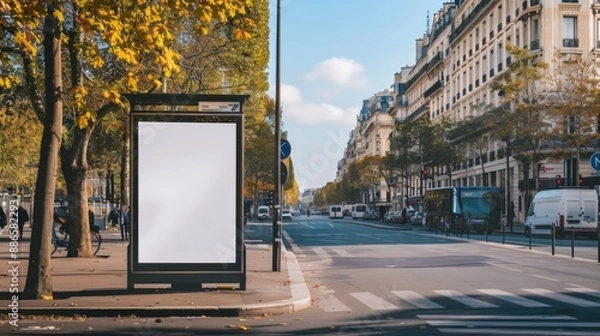 Fototapeta Bus stop billboard Mockup in empty street in Paris Parisian style hoarding advertisement close to a park in beautiful city