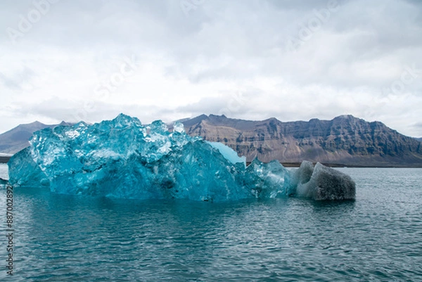 Fototapeta Stranded Iceberg broken off from glacier field floating around in Jokulsarlon in Iceland