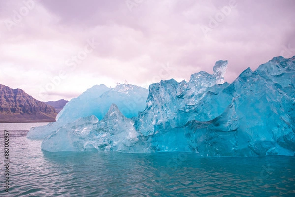 Fototapeta Stranded Iceberg broken off from glacier field floating around in Jokulsarlon in Iceland