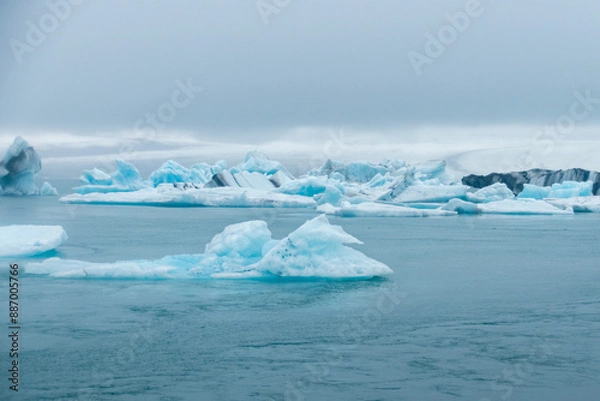 Fototapeta Stranded Iceberg broken off from glacier field floating around in Jokulsarlon in Iceland