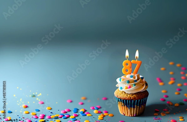 Fototapeta Birthday cupcake with number eighty-seven candle