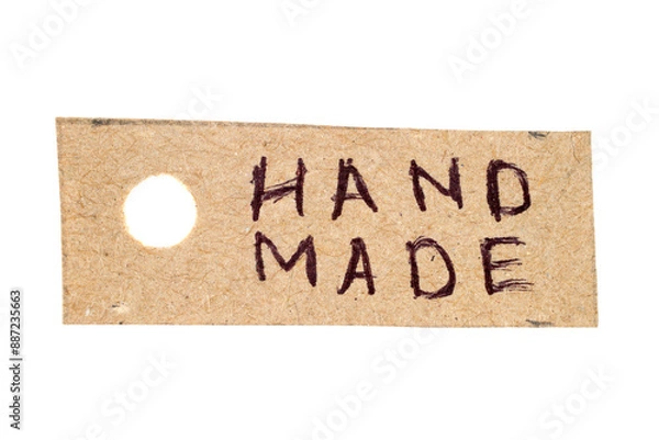 Fototapeta Cardboard label with hand-made inscription Hand made. The label is isolated on a white background.