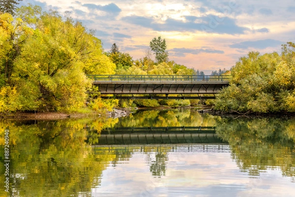 Obraz the Whitefish River flowing under a bridge in autumn at Whitefish, Montana