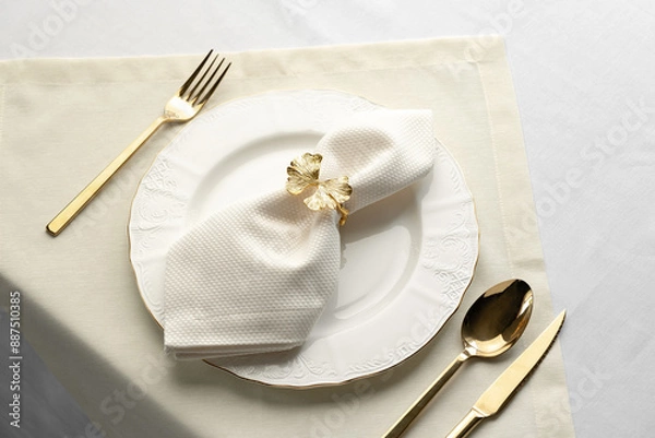 Fototapeta Gold Leaf Napkin Ring on White Plate and Placemat