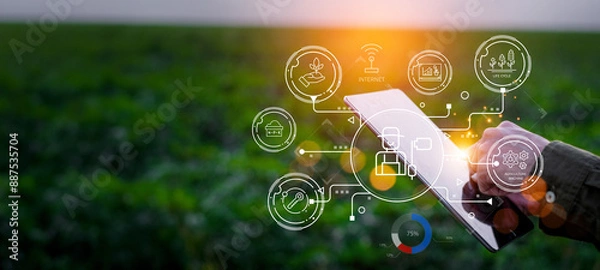 Fototapeta Farmers use agricultural technology in data analysis tablets and image icons. New technologies in agricultural business concepts. Men use tablets to research and develop plant varieties, agricultural