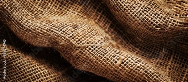 Fototapeta Detailed close up image of a brown burlap texture suitable as a background with copy space image
