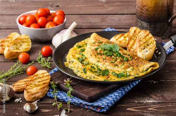 Obraz Herb omelette with chives and oregano sprinkled with Herb omelette with chili flakes