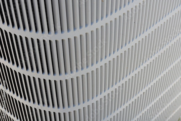 Fototapeta An abstract image of the metal fins and grating on a heat pump coil.