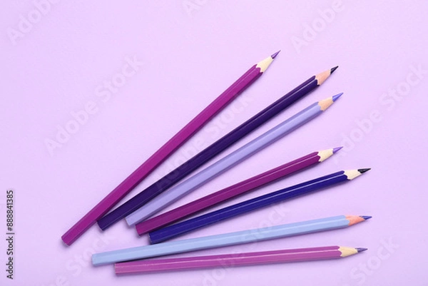 Obraz Different pencils on purple background