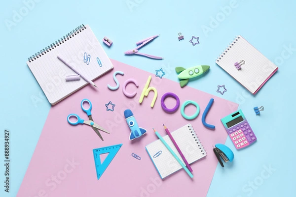 Fototapeta Rockets made of plasticine with different stationery and word SCHOOL on colorful background. Top view