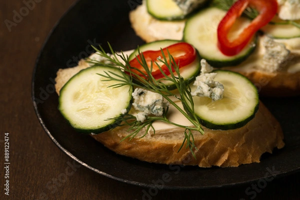 Obraz Сheese and cucumber baguette canapes, close-up