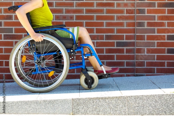 Obraz woman on wheelchair entering the platform