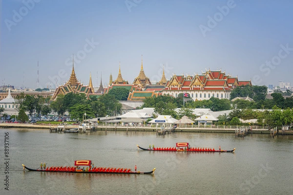 Fototapeta Landscape of Thai's king palace with goldent guard ship on the front.