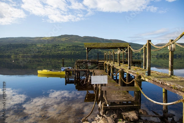 Obraz A view of a jetty on the Scottish Loch Tay, on a sunny summers morning
