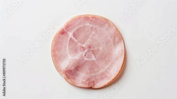 Fototapeta Top view of a slice of boiled ham sausage placed on a clean white background, highlighting the smooth texture and pink hue of the meat, perfect for culinary uses and food presentation.