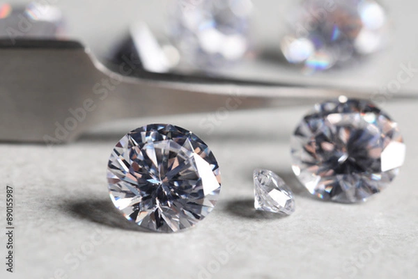 Fototapeta Many beautiful shiny diamonds on light background, closeup