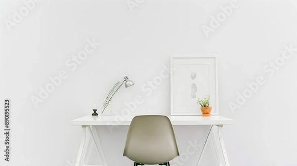 Fototapeta A white desk with a lamp and a framed white picture