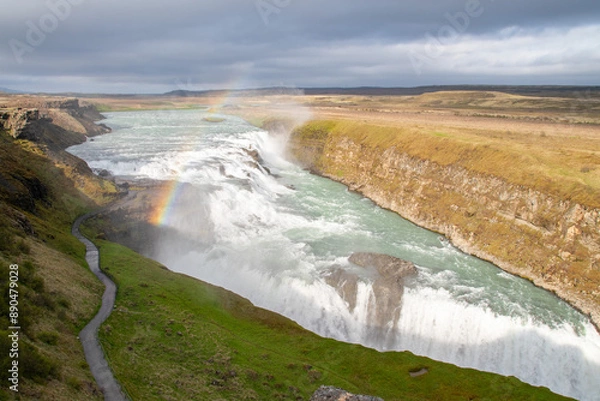 Fototapeta A partial rainbow over the gushing Gullfoss waterfall in Iceland