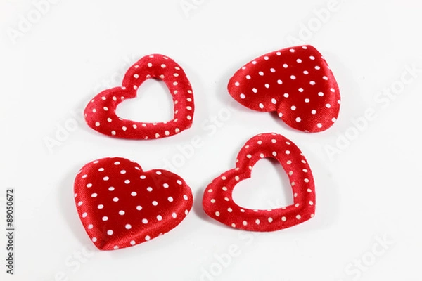 Fototapeta The red hearts on the white background.