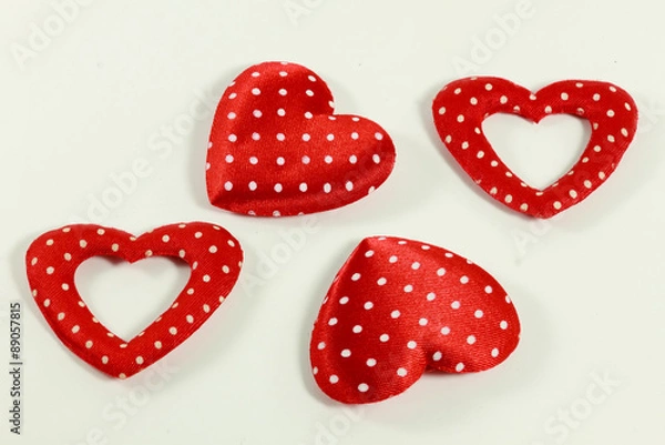 Fototapeta The red hearts on the white background.