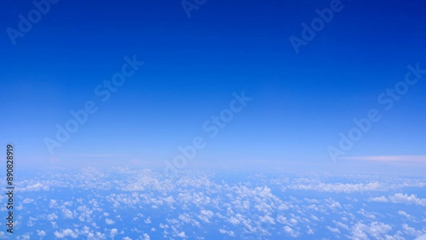 Obraz Horizontal gradient blue sky with white fluffy clouds