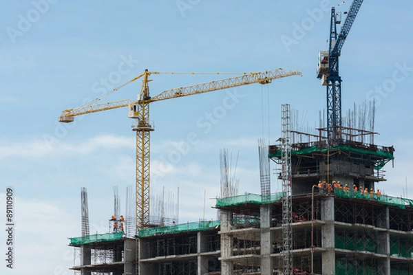 Fototapeta Building crane and building under construction