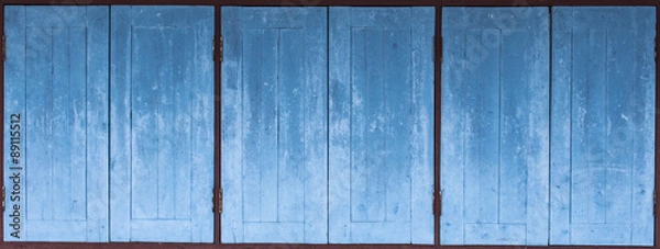Fototapeta aged grunge weathered blue door wood texture Mediterranean backg