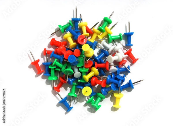 Obraz Push pins on a white background