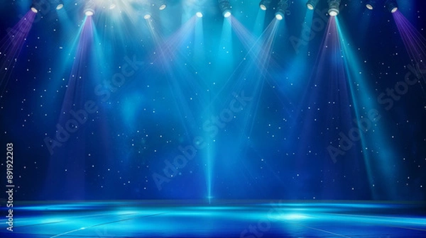 Fototapeta Illuminated stage with dramatic blue lighting and spotlights, ideal for performances or events