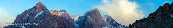 Obraz Evening panorama of Fan Mountains range.
Large and super wide panoramic image of high peaks in sunset light
