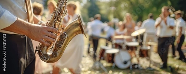 Obraz Jazz band playing in a park, saxophone and drums, people dancing around, energetic and joyful, perfect for outdoor concert themes, copy space.