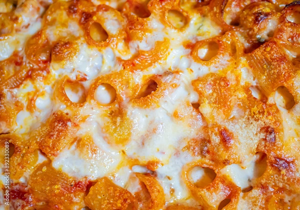 Obraz Italian baked pasta with gorgonzola, mozzarella, bechamel and tomato. Top view