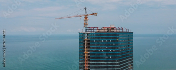 Fototapeta Aerial View the Building Construction. Aerial View Of City Development. Skyscraper Building Process Aerial