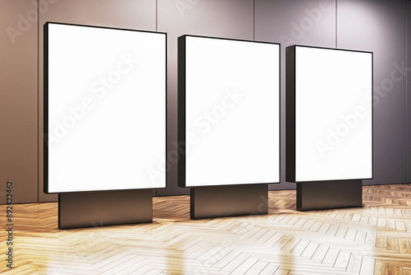 Fototapeta Three blank digital billboards in a modern interior room. 3D Rendering