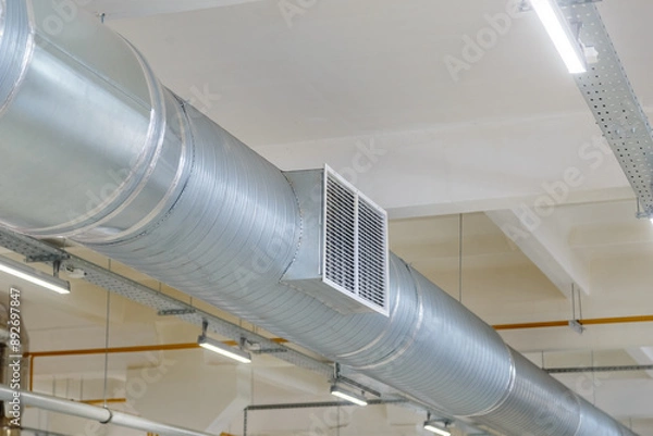 Fototapeta Internal air duct at the enterprise in the workshop with ventilation holes