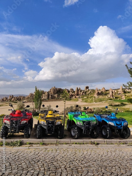 Fototapeta beautiful  ATVs on the beautiful mountain scenery in the city Cappadocia in Turkey