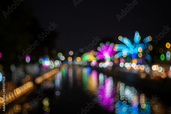 Fototapeta blurred bokeh of night street and river background