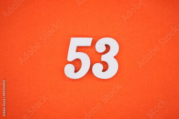 Obraz The numbers are made of white painted wood. Placed on the floor was orange paper.