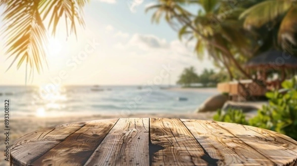 Fototapeta A wooden deck overlooking a tropical beach with palm trees and a bright sun, perfect for vacation and summer themes.