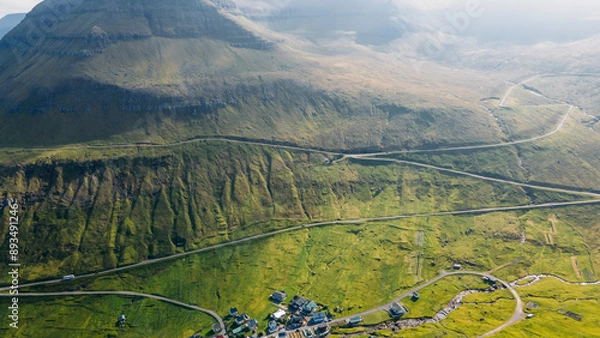 Fototapeta Funningur village, Faroe Islands. Sunny day in summer. Amazing nature in Faroe Islands. Eysturoy Island. Gonguturur or Hvithamar Trailhead. Faroese fjord and summits