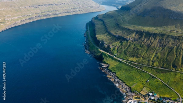 Fototapeta Funningur village, Faroe Islands. Sunny day in summer. Amazing nature in Faroe Islands. Eysturoy Island. Gonguturur or Hvithamar Trailhead. Faroese fjord and summits