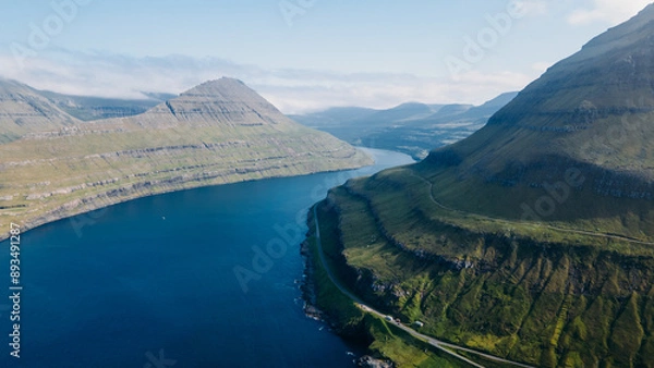 Fototapeta Funningur village, Faroe Islands. Sunny day in summer. Amazing nature in Faroe Islands. Eysturoy Island. Gonguturur or Hvithamar Trailhead. Faroese fjord and summits