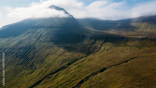 Fototapeta Funningur village, Faroe Islands. Sunny day in summer. Amazing nature in Faroe Islands. Eysturoy Island. Gonguturur or Hvithamar Trailhead. Faroese fjord and summits