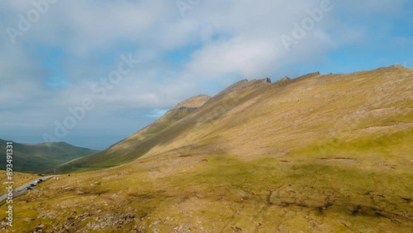 Fototapeta Funningur village, Faroe Islands. Sunny day in summer. Amazing nature in Faroe Islands. Eysturoy Island. Gonguturur or Hvithamar Trailhead. Faroese fjord and summits