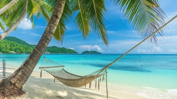 Fototapeta vibrant tropical beach with hammock, clear turquoise water, white sand, and palm trees swaying in the breeze