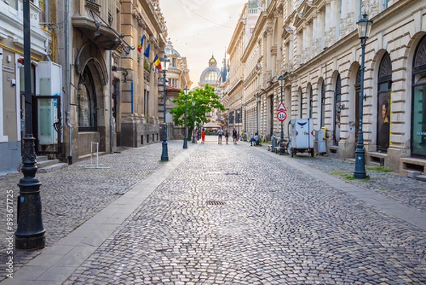 Fototapeta Street view of Old town in Bucharest, with old buildings and a paved road. 